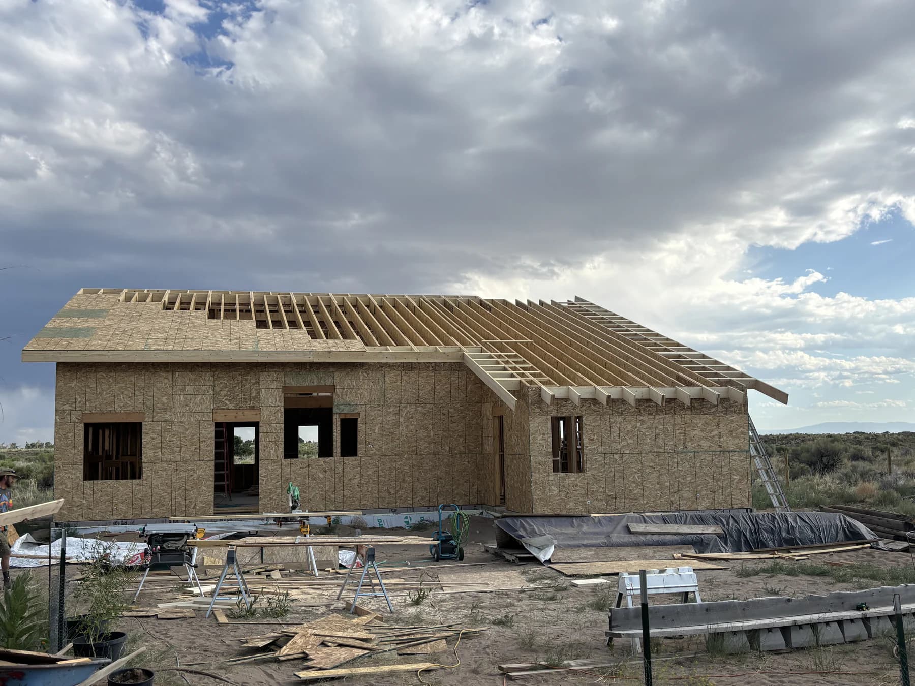 New Crestone home with exposed roof rafters and partially installed roof decking