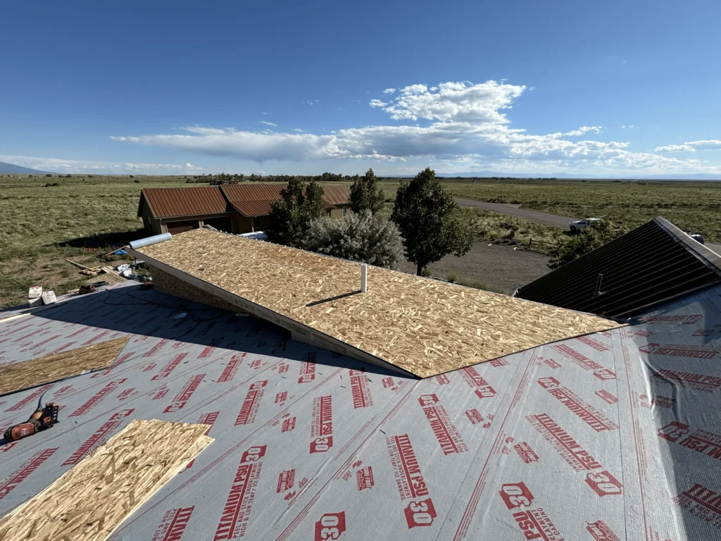 A roof being repaired and ventilation installed