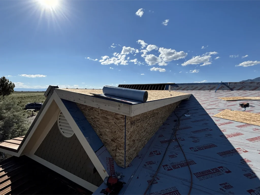 Ice and water protection being installed on a roof