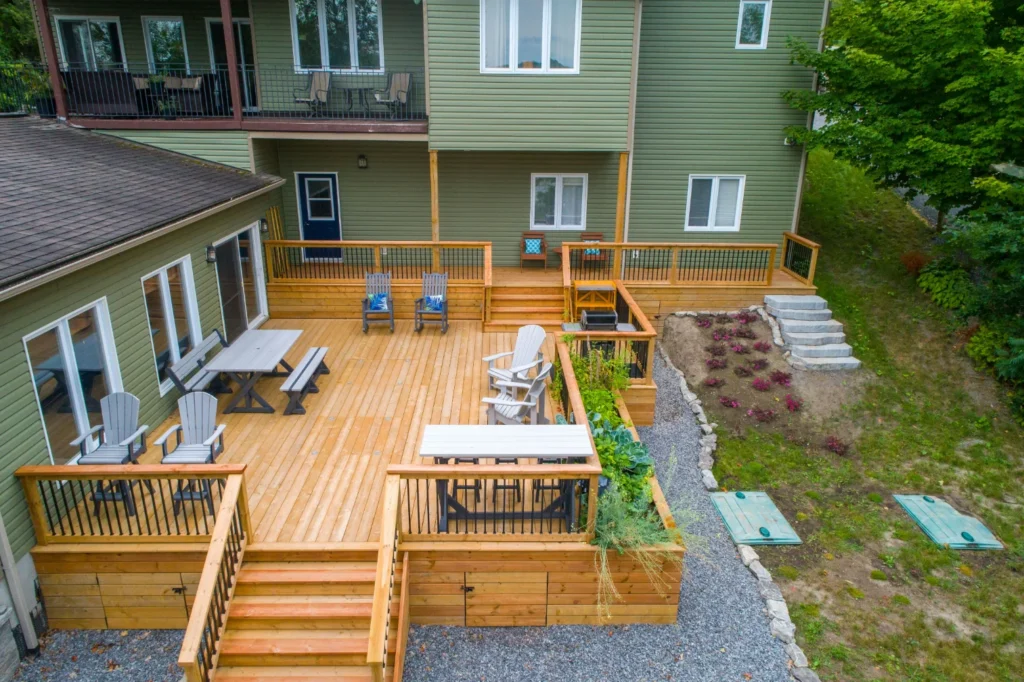 Aerial shot of a custom outdoor deck on a green house